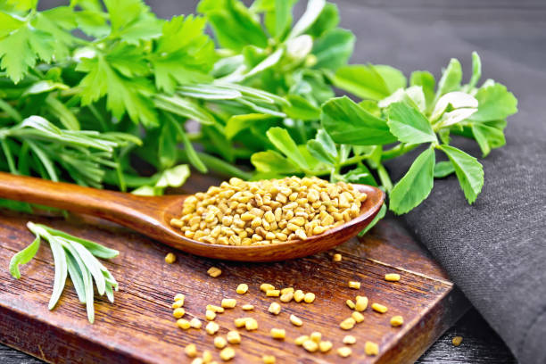 istock Fenugreek in spoon with herbs on board 1192610696