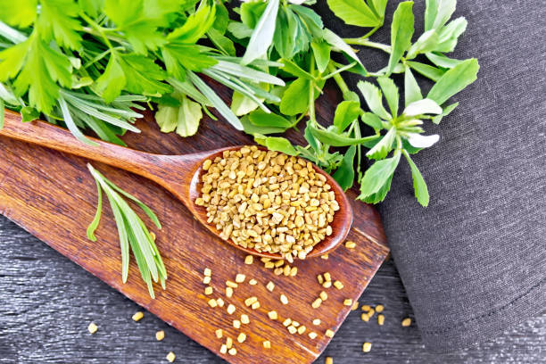 istock Fenugreek in spoon with herbs on board top 1192610697