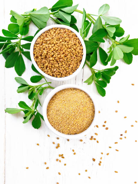 istock Fenugreek in two bowls with leaves on board top 1192610703