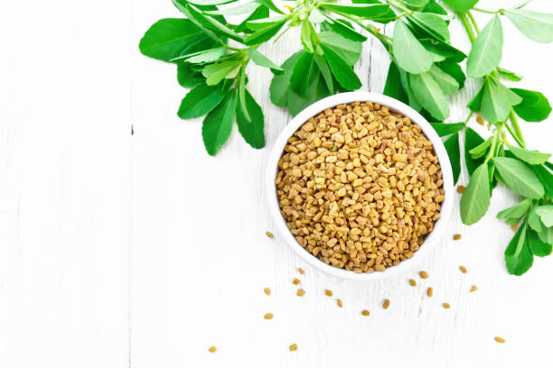 istock Fenugreek with green leaves in bowl on board top 1192610708