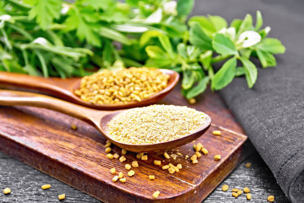 istock Fenugreek in two spoons with herbs on board 1192610736