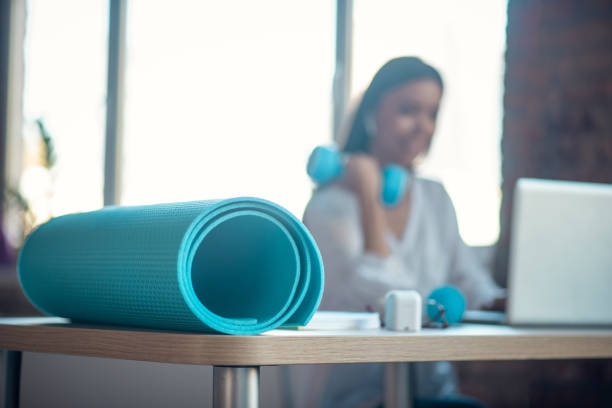 istock Selective focus of a blue yoga mat 1192610767