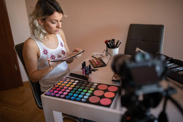 istock Beautiful young woman vlogging about cosmetics 1192611875