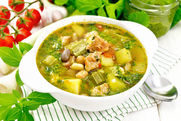 istock Soup with pisto sauce in bowl on light board 1192612870
