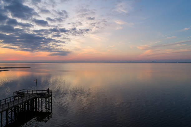 istock Pink December sky at sunset over Mobile Bay 1192614158