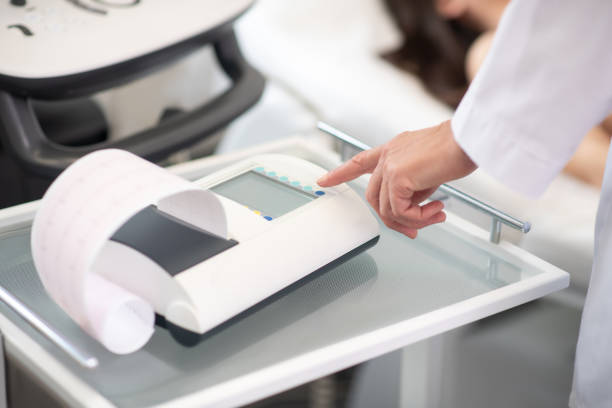 istock Close up of doctors hand pressing the button 1192615519