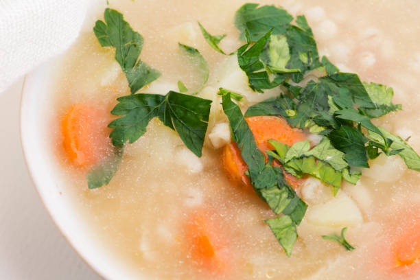 Barley soup, pearl barley in white bowl
