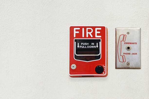 Fire Alarm Notifier and Fireman's Phone Jack on White Cement Plaster Wall with Copy Space for Security Concept Fire Alarm Notifier and Fireman's Phone Jack on White Cement Plaster Wall with Copy Space for Security Concept Notifier stock pictures, royalty-free photos & images