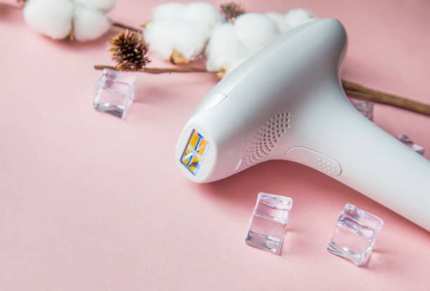 photo epilator for hair removal on the body, legs, armpits and bikini area photo epilator for hair removal on the body, legs, armpits and bikini area. epilator stock pictures, royalty-free photos & images