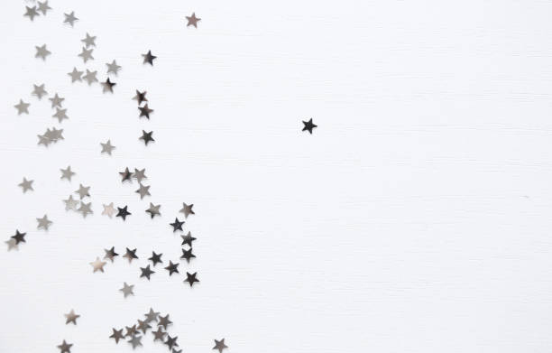 istock White minimal background. Silver stars top view, flatlay 1192621707