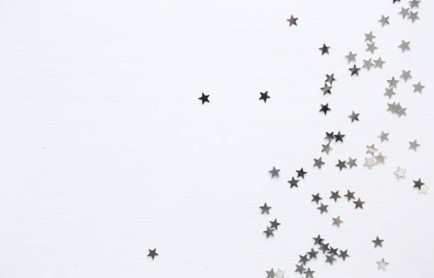 istock White minimal background. Silver stars top view, flatlay 1192621708