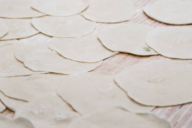 handmade Chinese traditional food dumpling wrapper on board