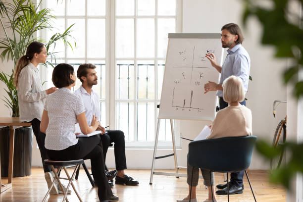 istock Speaker holding educational seminar or workshop for business people. 1192624633