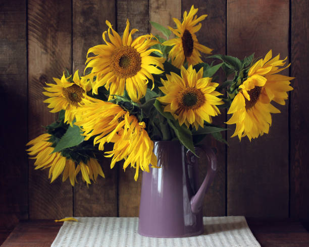 istock yellow sunflowers in a jug. 1192624970