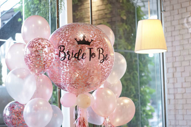 Pink balloons. Helium balloons in pink and white decoration for the hen party with the words written as Bride to be. stock photo