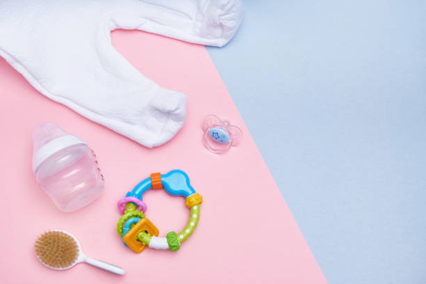 istock Baby accessories on pink and blue background. Flat lay . Top view Copy space 1192625730