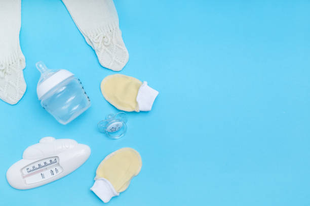 istock Cute baby accessories on blue background . Copy space Top view Flat lay 1192625737