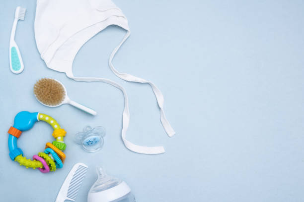 istock Cute baby accessories on blue background . Copy space Top view Flat lay. 1192625741