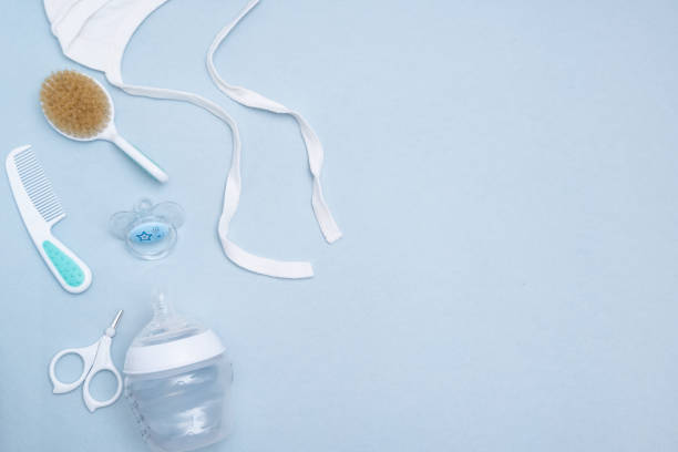 istock Lovely baby accessories on blue background . Copy space Top view Flat lay. 1192625744