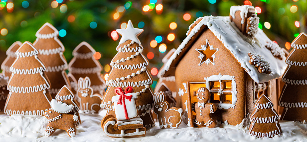 Gingerbread house christmas fir trees gift and animals cookies winter holiday celebration concept