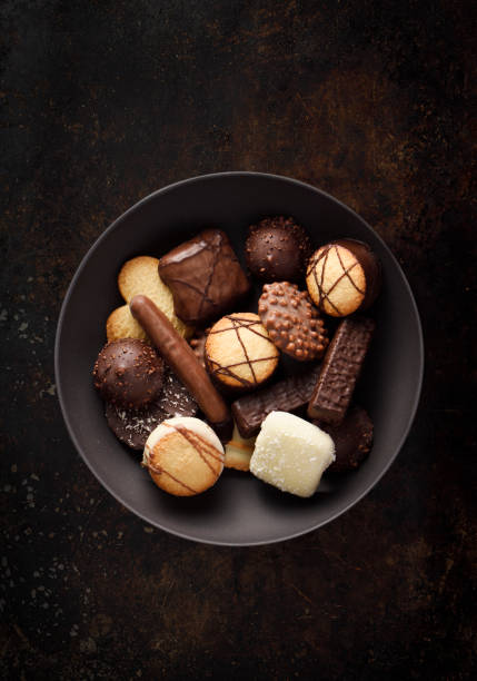 fancy cookies and chocolates - dark candy imagens e fotografias de stock