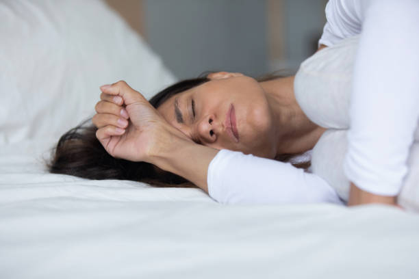 istock Woman lying in bed closed eyes crying feels miserable 1192627480