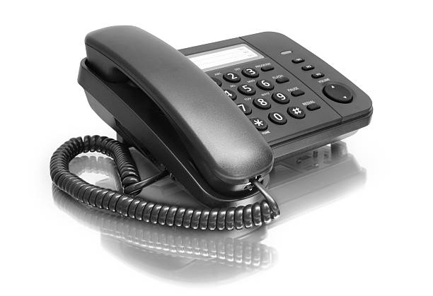 istock A black office phone on a white background 119262960