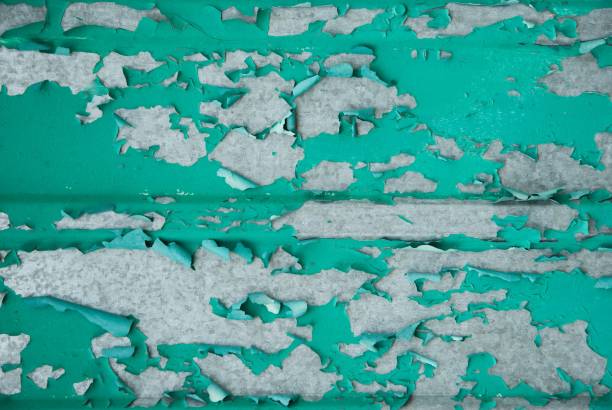 Old iron sheet with traces of rust. Blue paint with cracks