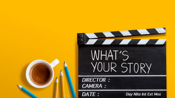 What's your story.world title on film slate and coffee cup on yellow background concept idea on film slate for movie maker world title stock pictures, royalty-free photos & images