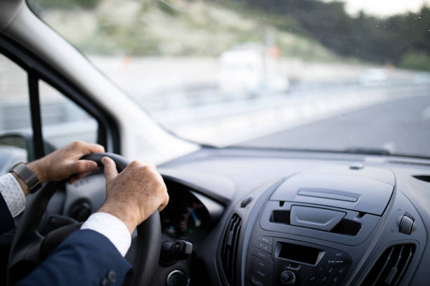 istock Senior Businessman Driving Car 1192634440