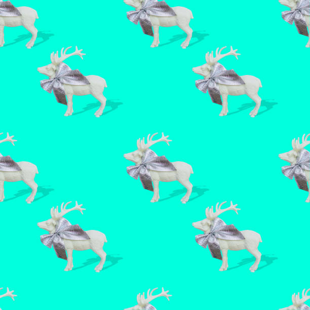 istock Seamless pattern made with various reindeers for Christmas and New Year on bright turquoise or aquamarine background with strong shadows 1192635017