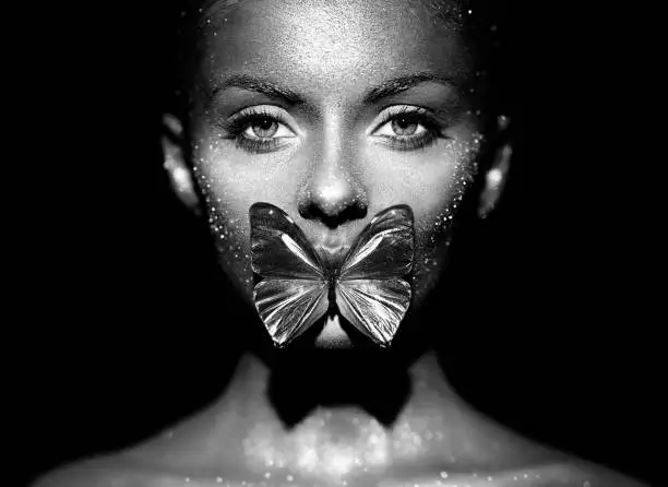 Photo of Fashion model woman with blue butterfly