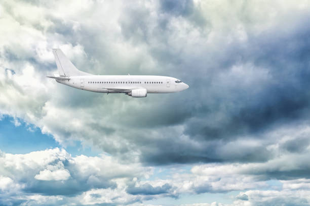 istock Airplane in the sky with thunderclouds. Transport. Air Transport. 1192636161