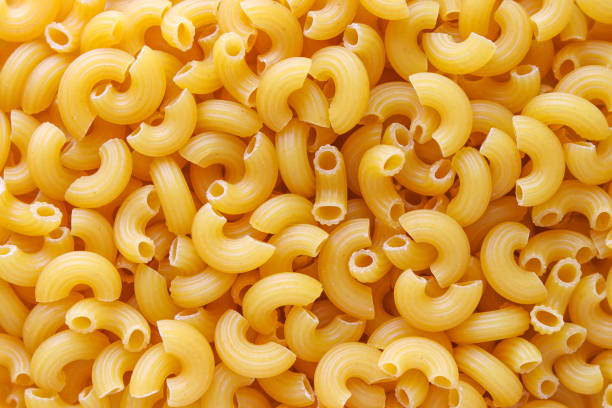 istock Macaroni spaghetti pattern background. Macaroni is a type of pasta. 1192637259