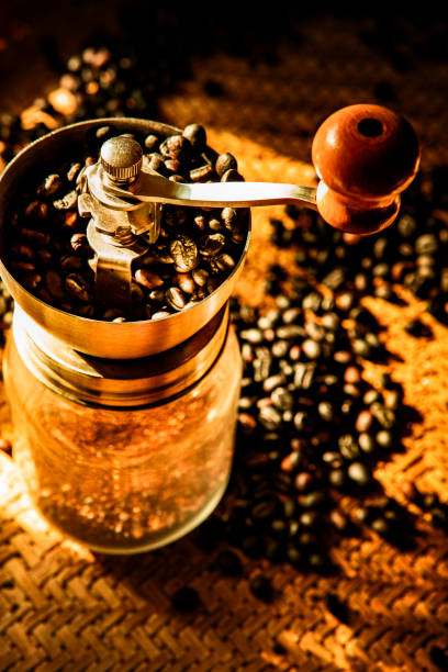 istock coffee grinder and roasted of coffee bean 1192638038
