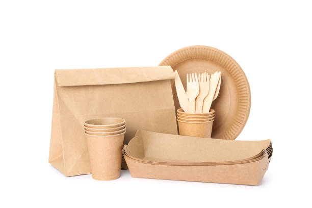 istock Eco - friendly tableware and paper bag isolated on white background. Disposable dishes 1192638939