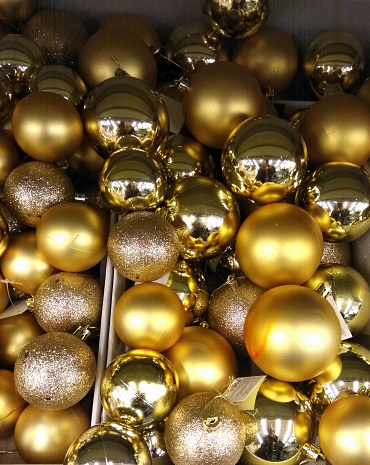 Golden Christmas Ball Ornaments. Shiny holiday background.