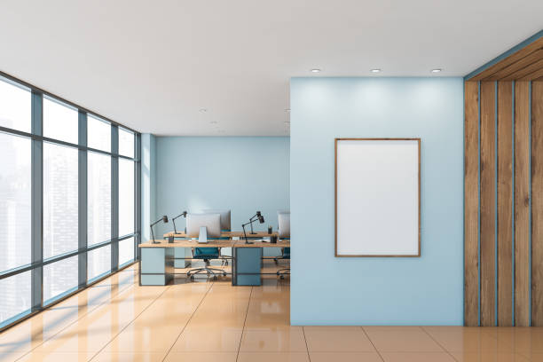 istock Blue and wooden open space office with poster 1192642063