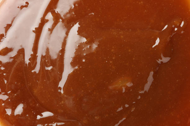 istock Brown caramel textured background, close up. Backdrop for design 1192642172