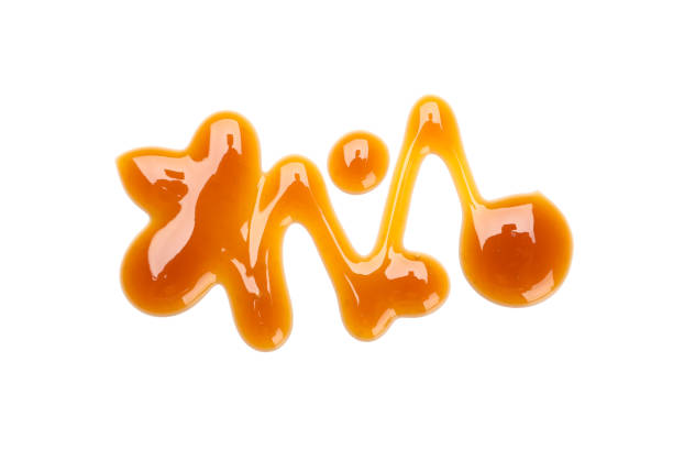istock Sweet caramel sauce isolated on white background, close up 1192642197