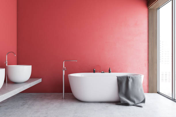 istock Red bathroom interior with tub and sinks 1192642268