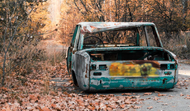 istock abandoned broken rusty car on Chernobyl street 1192642283