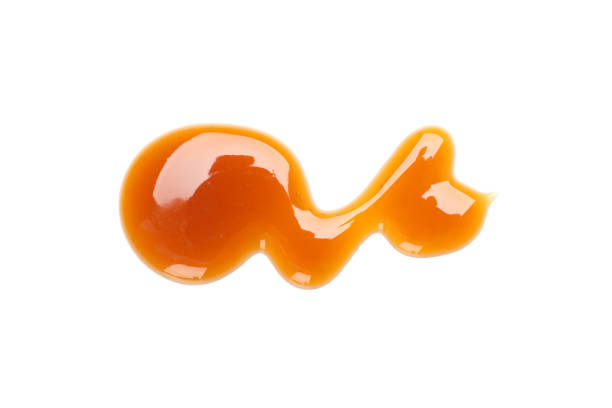 istock Sweet caramel sauce isolated on white background, close up 1192642441