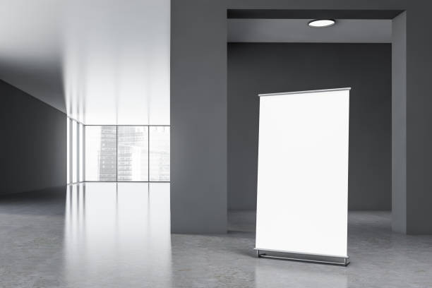 istock Vertical mock up banner in gray office hall 1192643103