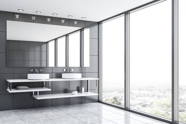 istock Gray tile bathroom with double sink 1192643161