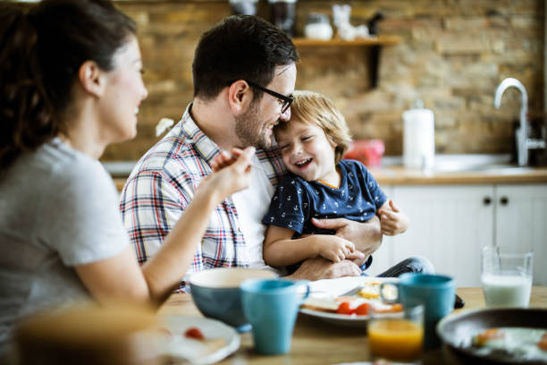 istock Young family enjoying during their meal at dining table. 1192643185