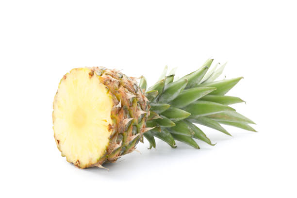 istock Half of pineapple isolated on white background 1192643218