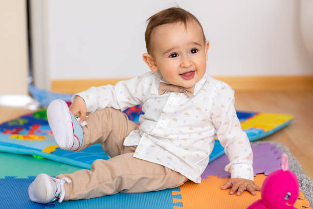istock Cute baby boy playing on floor 1192643407