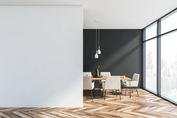 istock Gray and white dining room with mock up wall 1192644291