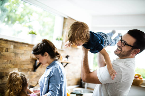 istock Happy father having fun with his small son in the kitchen. 1192644337